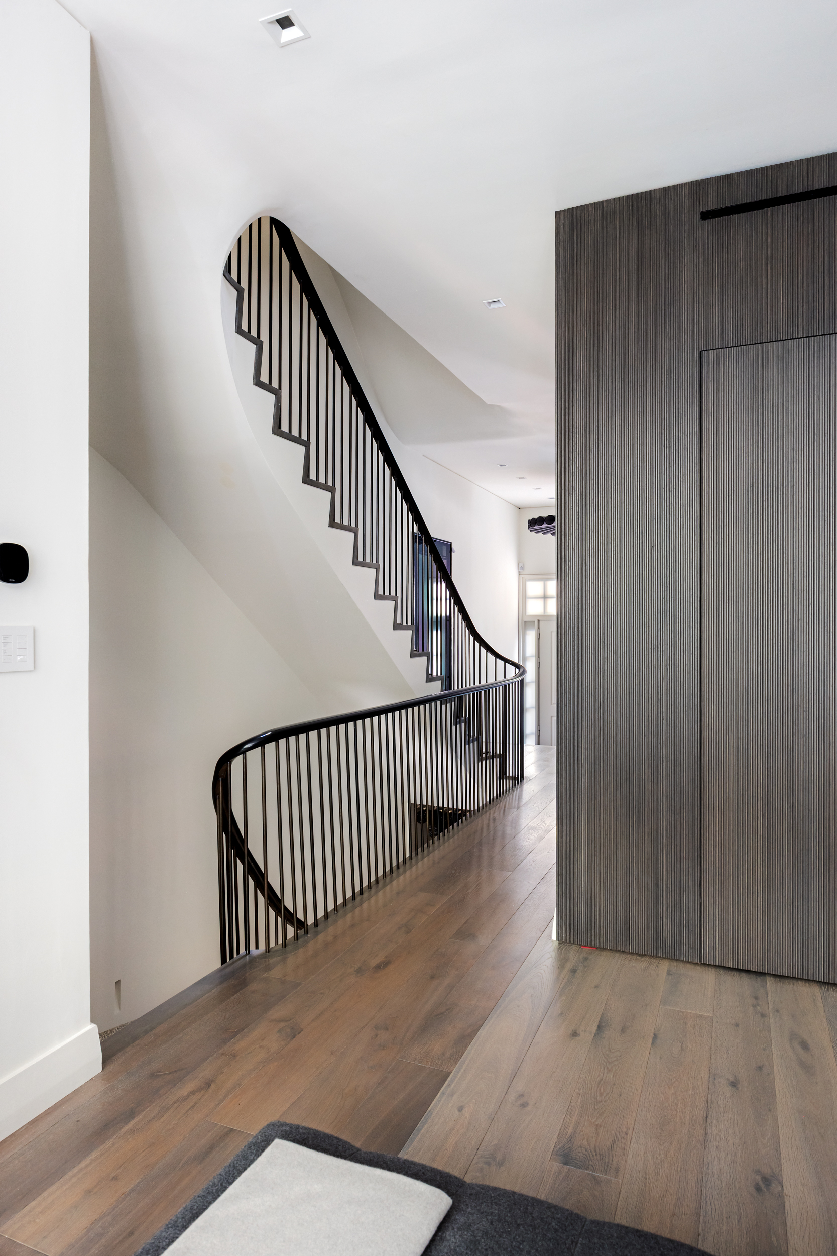 146 Waverly Place Manhattan, NY 10014 - Photo 9 of 41 a view of staircase with wooden floor and a rug