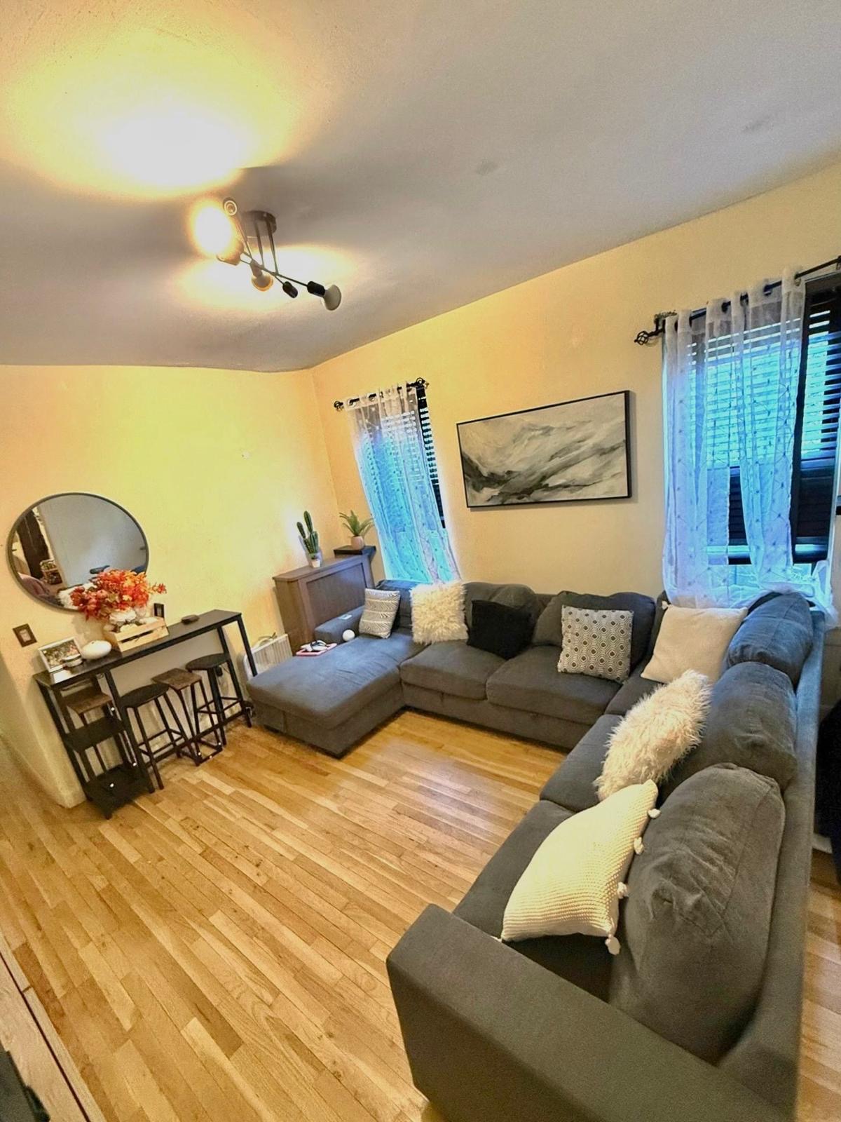 883 East 165th Street, Unit 1F Bronx, NY 10459 - Photo 4 of 7 a living room with furniture
