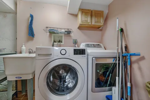 a view of a building with dining table and chairs