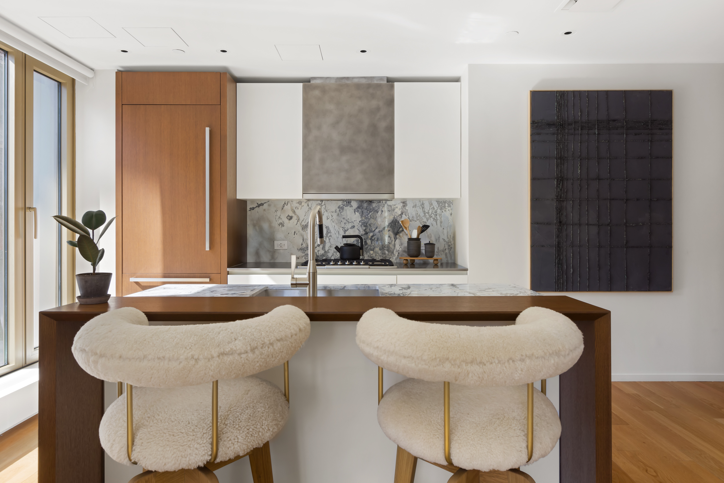 75 Kenmare Street, Unit 2D Manhattan, NY 10012 - Photo 6 of 15 a bath room with sink and a couch