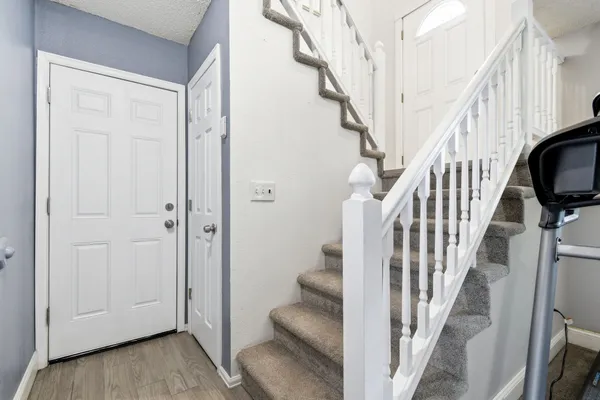a view of a house with swimming pool and sitting area
