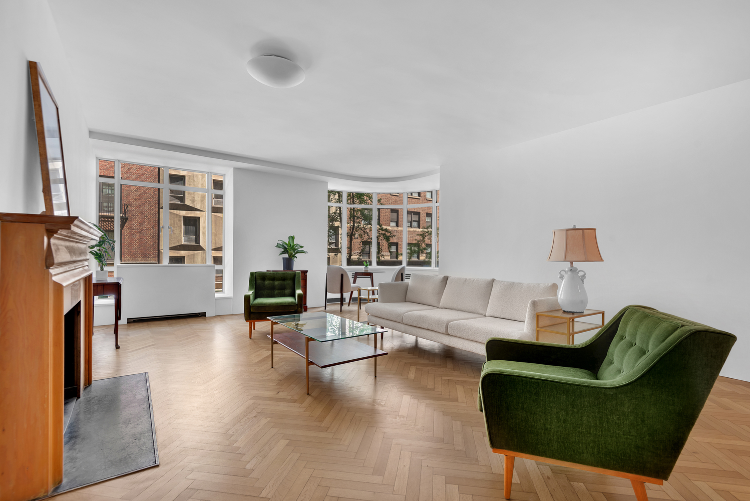 24 West 55th Street, Unit 3D Manhattan, NY 10019 - Photo 1 of 10 a living room with furniture and a wooden floor
