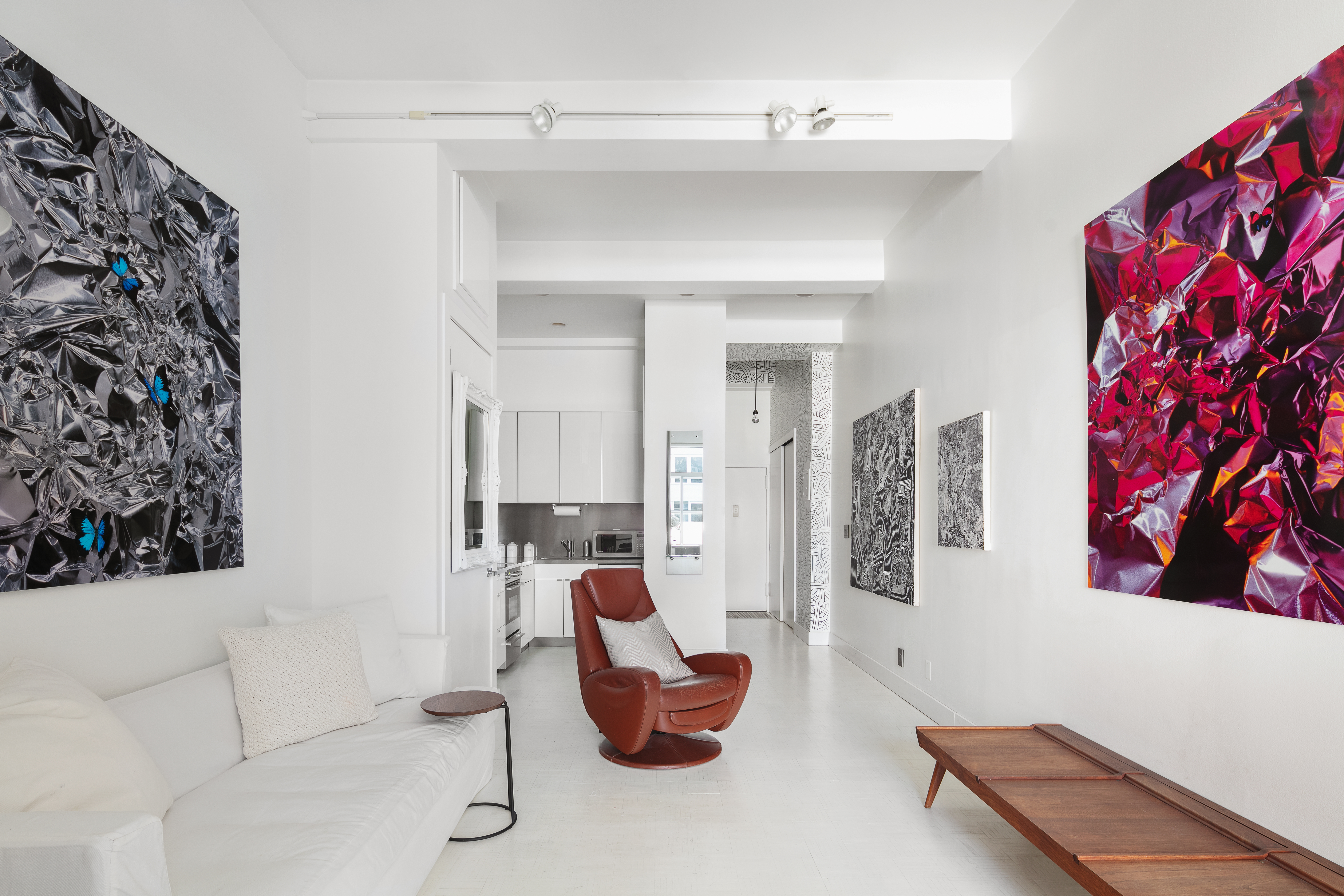 244 Madison Avenue, Unit PHE Manhattan, NY 10016 - Photo 18 of 20 a living room with furniture and flat screen tv