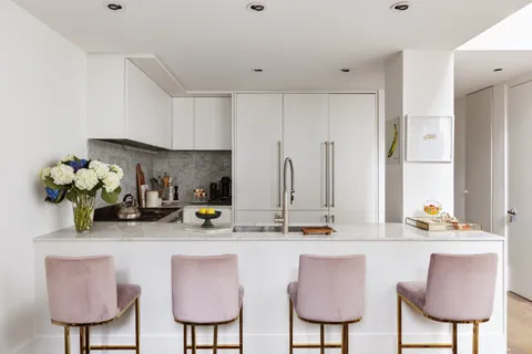 a kitchen with stainless steel appliances a sink and a cabinets