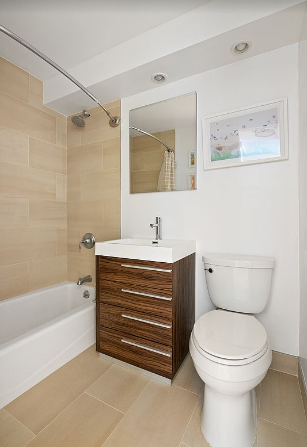 201 East 25th Street, Unit 4C Manhattan, NY 10010 - Photo 4 of 6 a bathroom with a sink a toilet and a bathtub