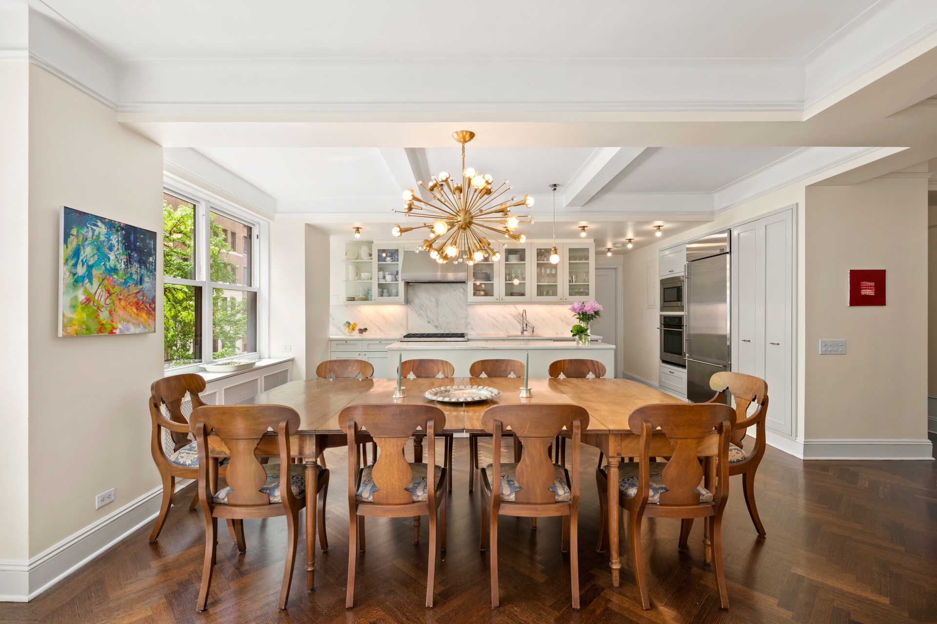 225 East 79th Street, Unit 3A Manhattan, NY 10075 - Photo 2 of 10 a view of a dining room with furniture and chandelier