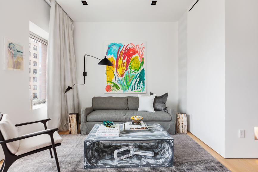 177 9th Avenue, Unit 5H Manhattan, NY 10011 - Photo 9 of 20 a living room with furniture and a wall painting