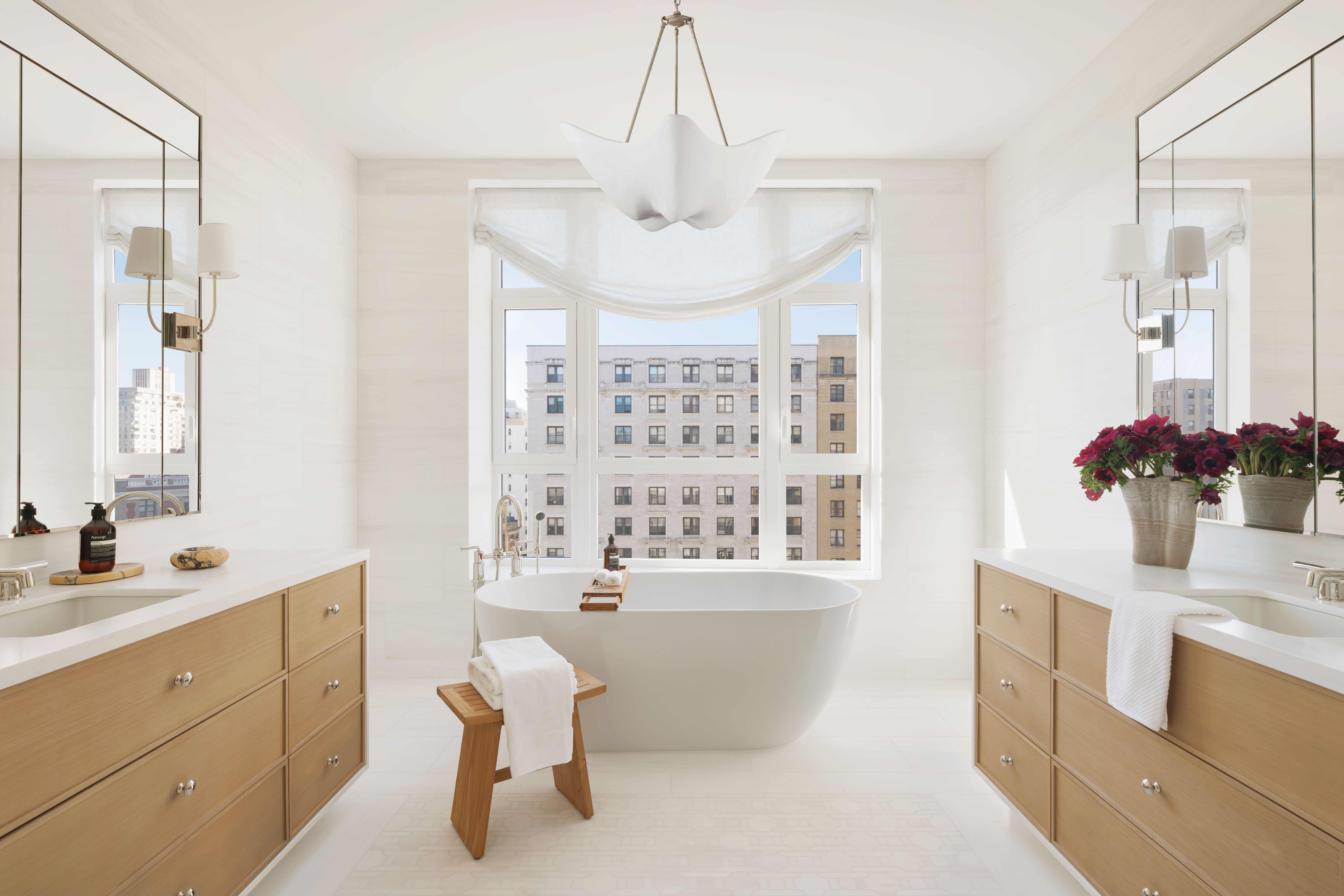 211 West 84th Street, Unit 10WEST Manhattan, NY 10024 - Photo 7 of 32 a spacious bathroom with a double vanity sink mirror and bathtub