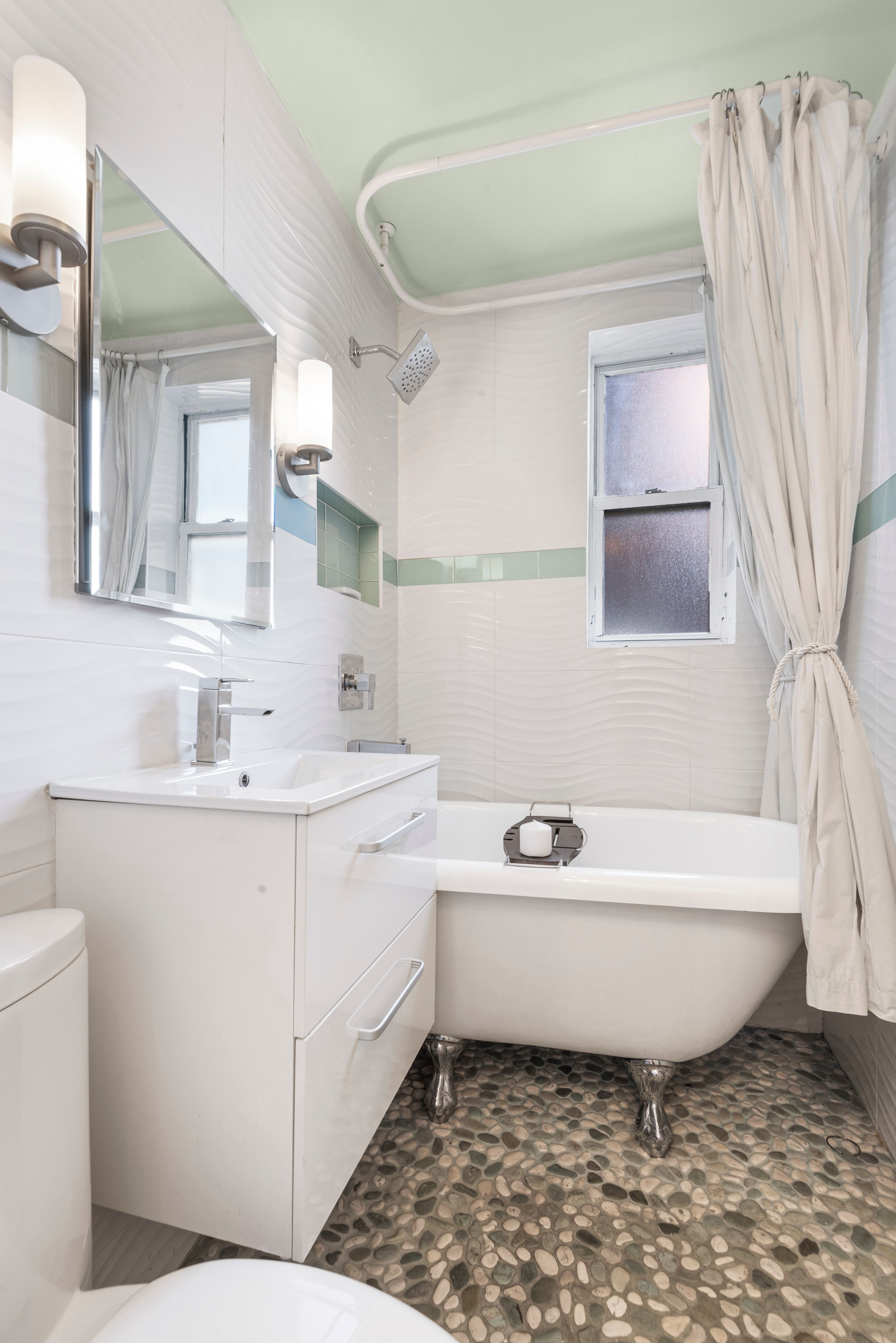 61 Oliver Street, Unit 4P Brooklyn, NY 11209 - Photo 8 of 11 a bathroom with a sink toilet and bathtub