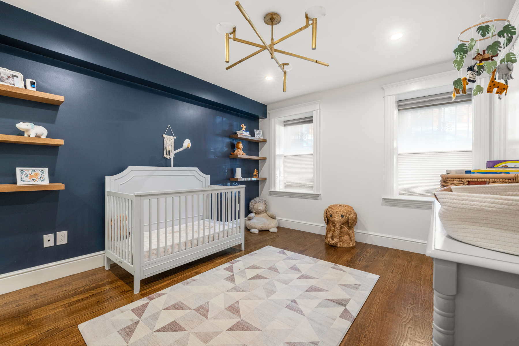 34 Dwight Street, Unit 1 Boston, MA 02118 - Photo 18 of 33 a bedroom with a bed and wooden floor