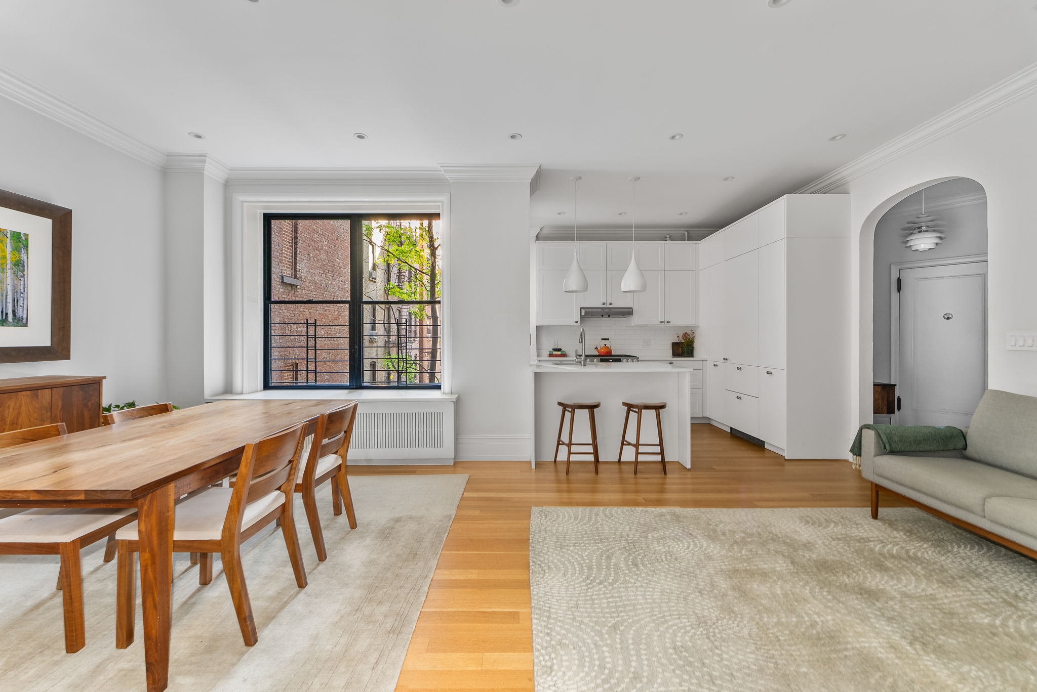 210 Riverside Drive, Unit 2E Manhattan, NY 10025 - Photo 2 of 15 a view of a dining room with furniture and a table