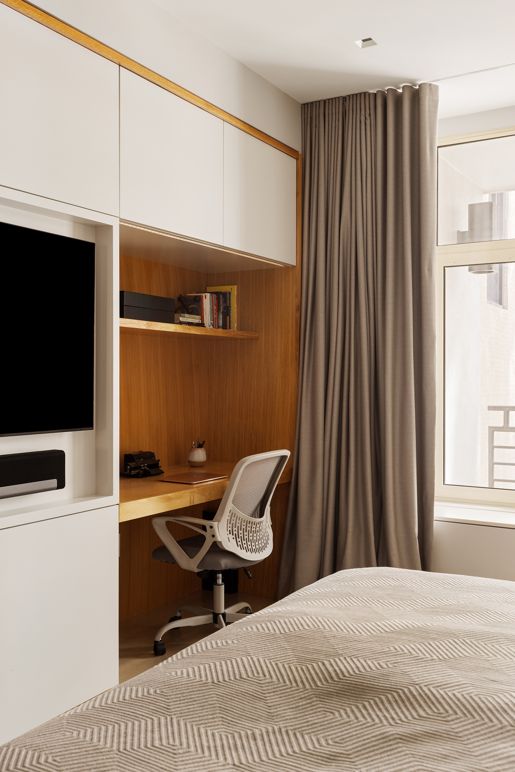129 West 20th Street, Unit 4B Manhattan, NY 10011 - Photo 9 of 16 a bedroom with a bed and a television