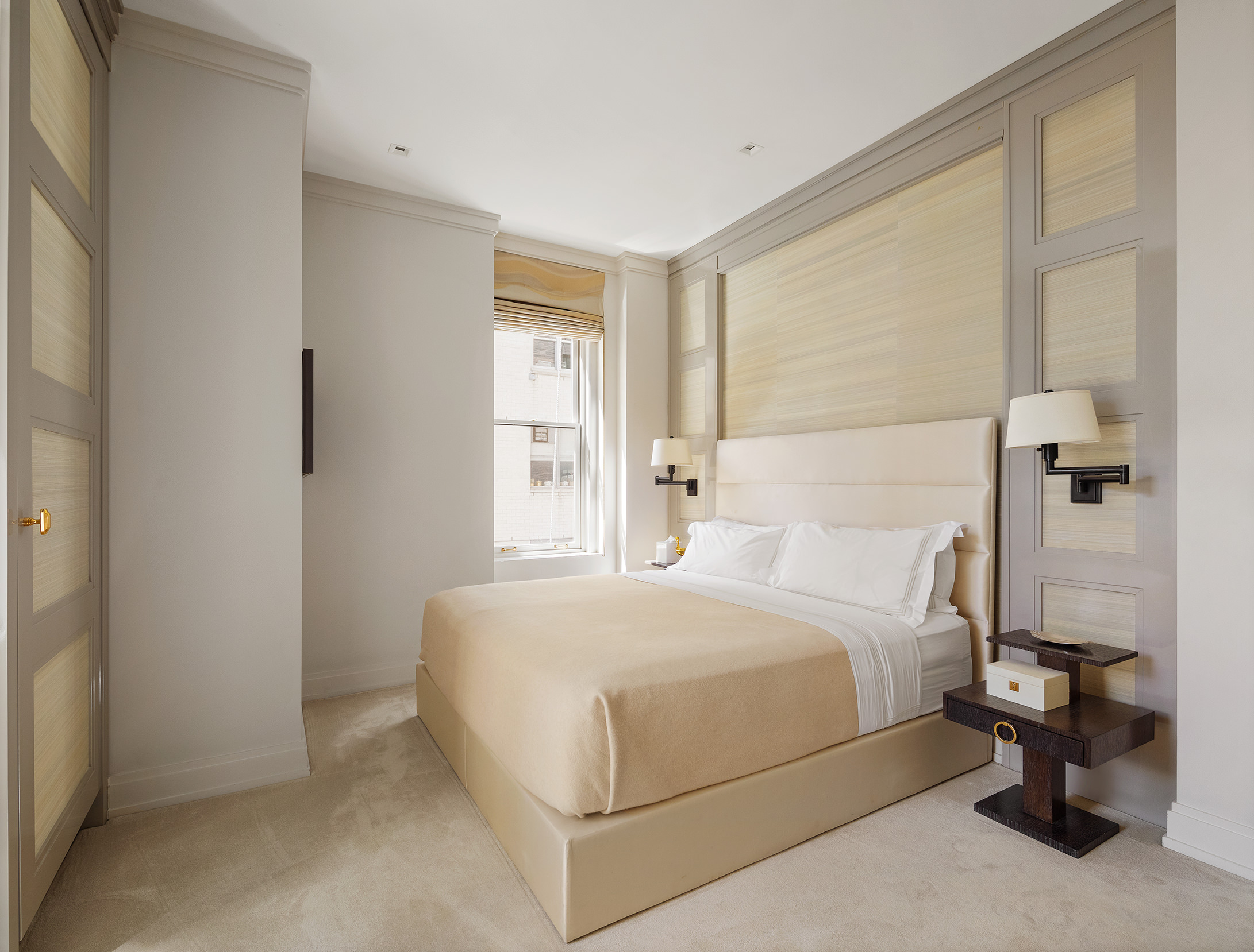 907 5th Avenue, Unit 7A Manhattan, NY 10021 - Photo 5 of 18 a bedroom with a bed and a window