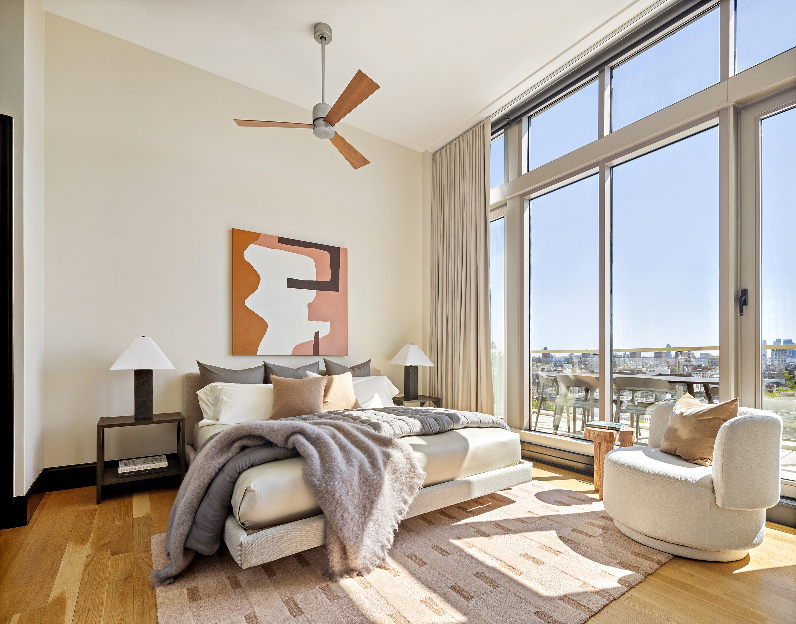 144 North 8th Street, Unit 12A Brooklyn, NY 11249 - Photo 10 of 21 a bedroom with furniture and a large window