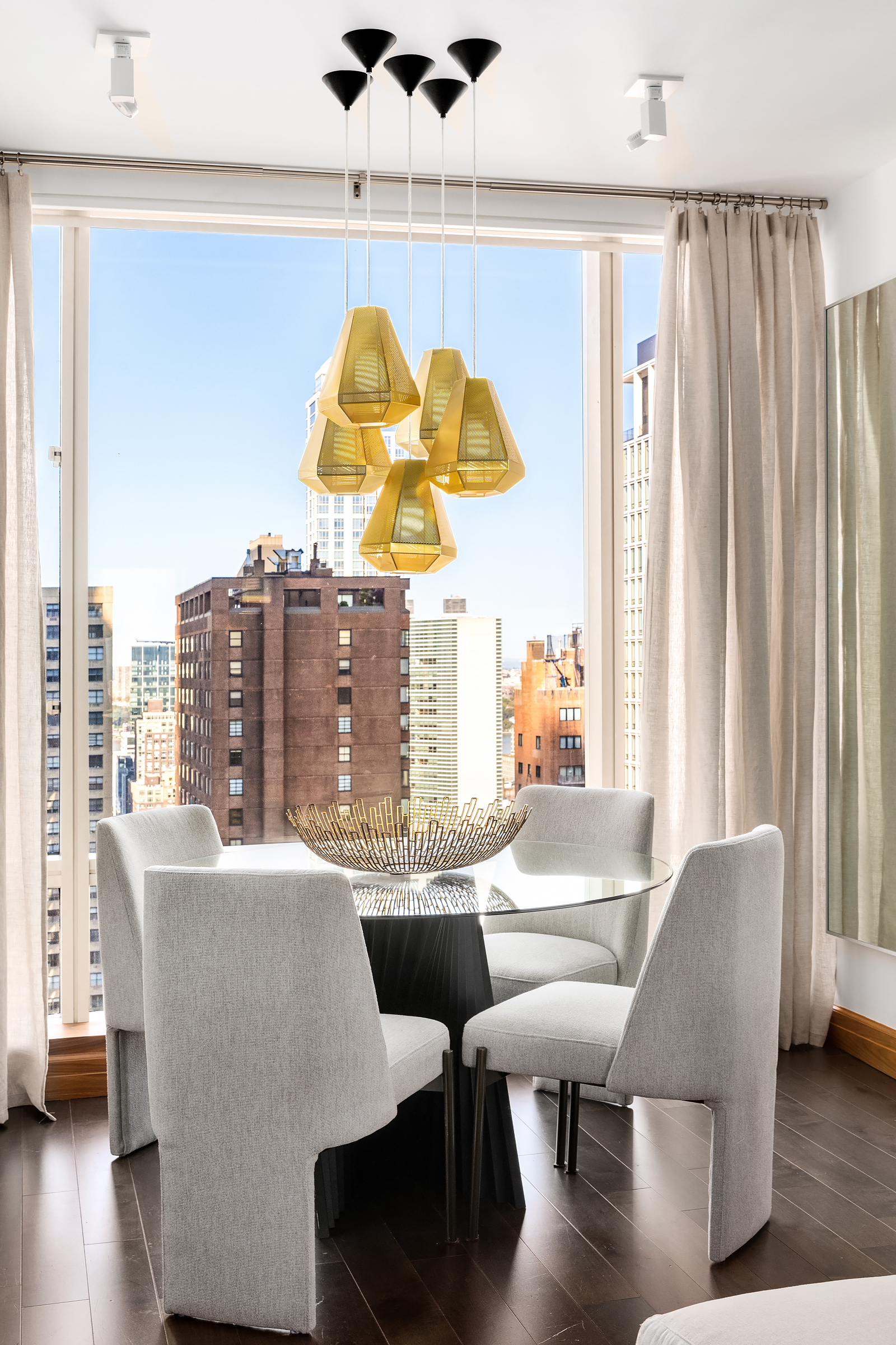 1 Central Park West, Unit 30E Manhattan, NY 10023 - Photo 2 of 12 a view of a dining room with furniture window and wooden floor