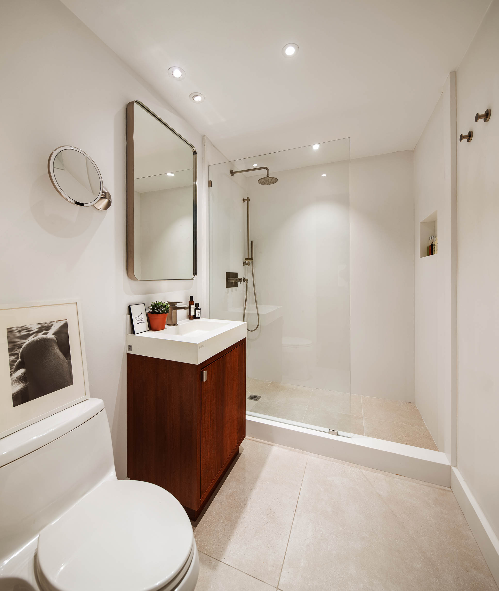 425 East 13th Street, Unit 3F Manhattan, NY 10009 - Photo 10 of 16 a bathroom with a sink vanity mirror and toilet