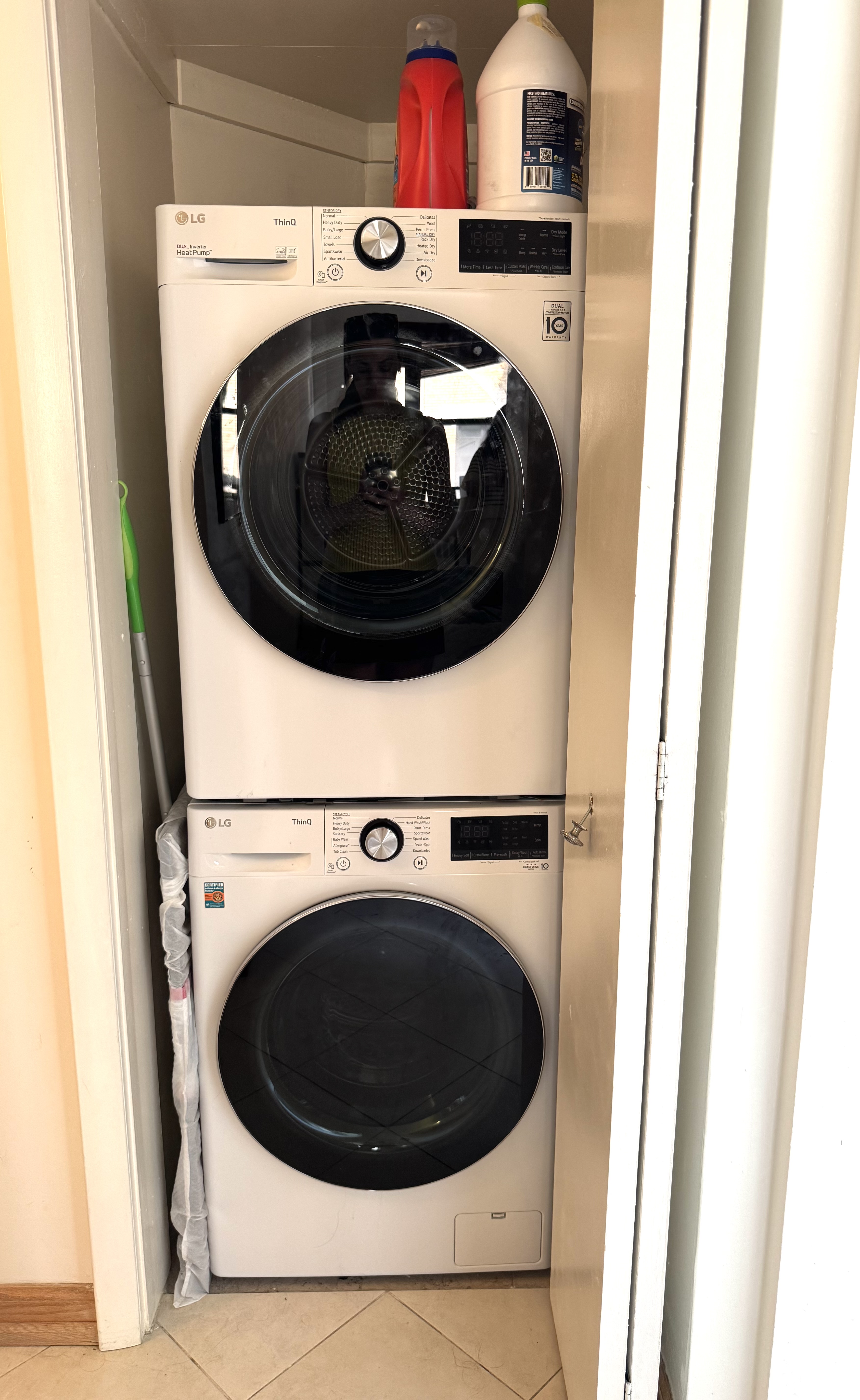 61 East 77th Street, Unit 7E Manhattan, NY 10075 - Photo 3 of 10 a utility room with dryer and washer
