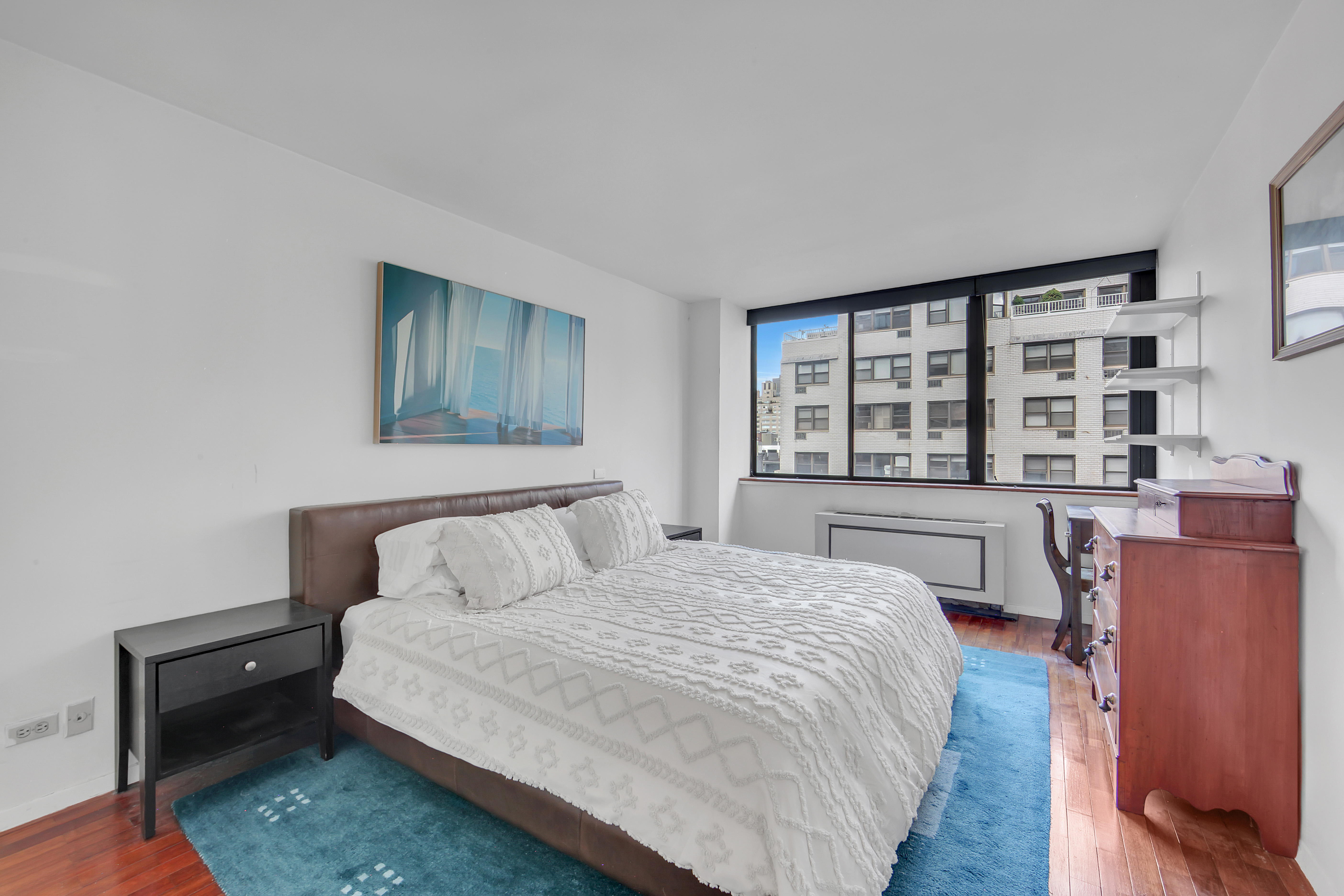 330 East 75th Street, Unit 8H Manhattan, NY 10021 - Photo 5 of 11 a bedroom with a bed and a window