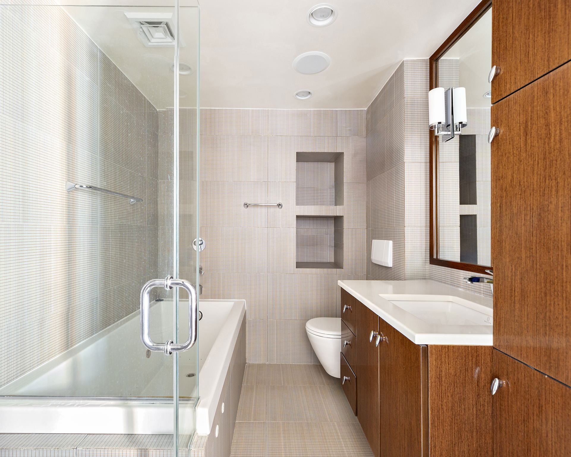 889 Broadway, Unit PHA Manhattan, NY 10003 - Photo 6 of 11 a bathroom with a tub sink and mirror