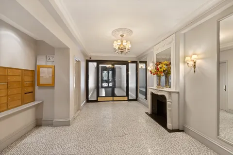 a view of entryway with chandelier and livingroom