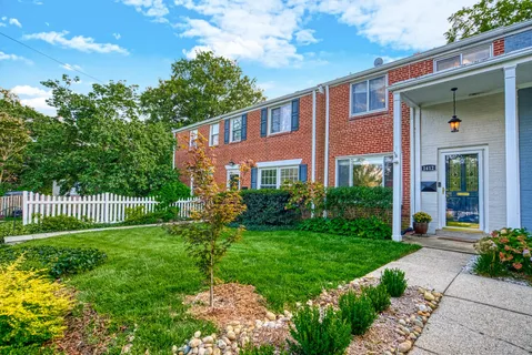 a view of a house with a yard and plants