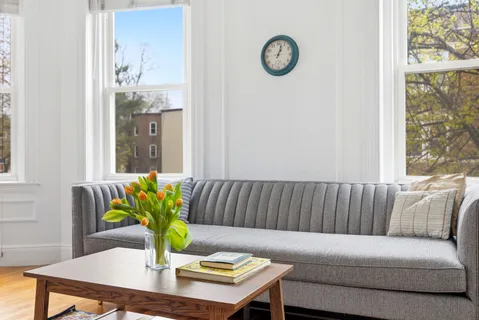 a living room with furniture and window