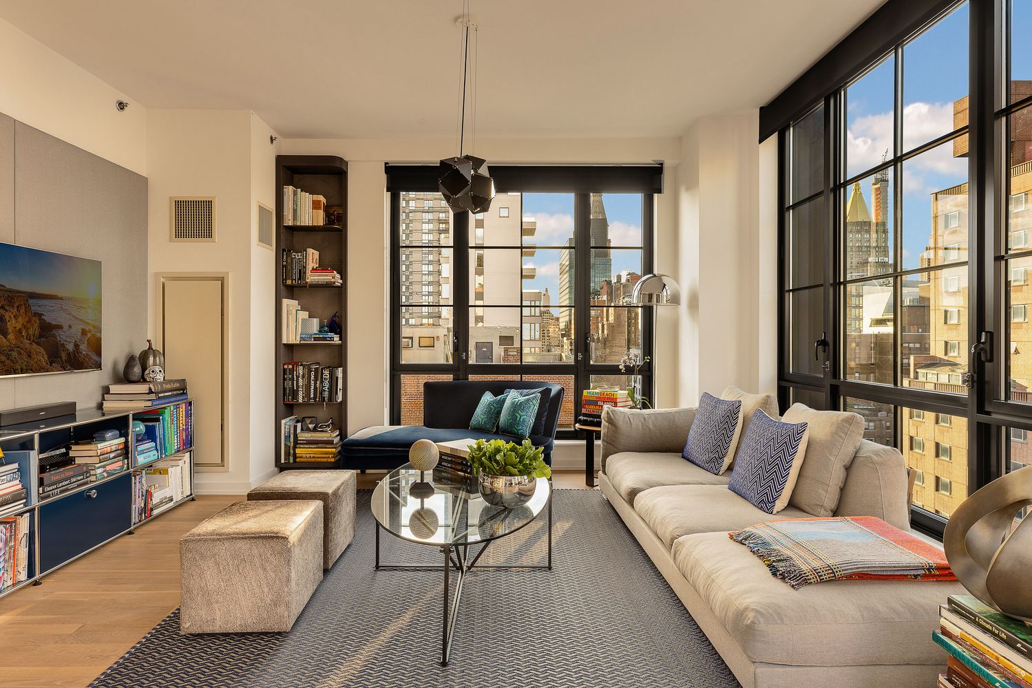 a living room with furniture and a flat screen tv