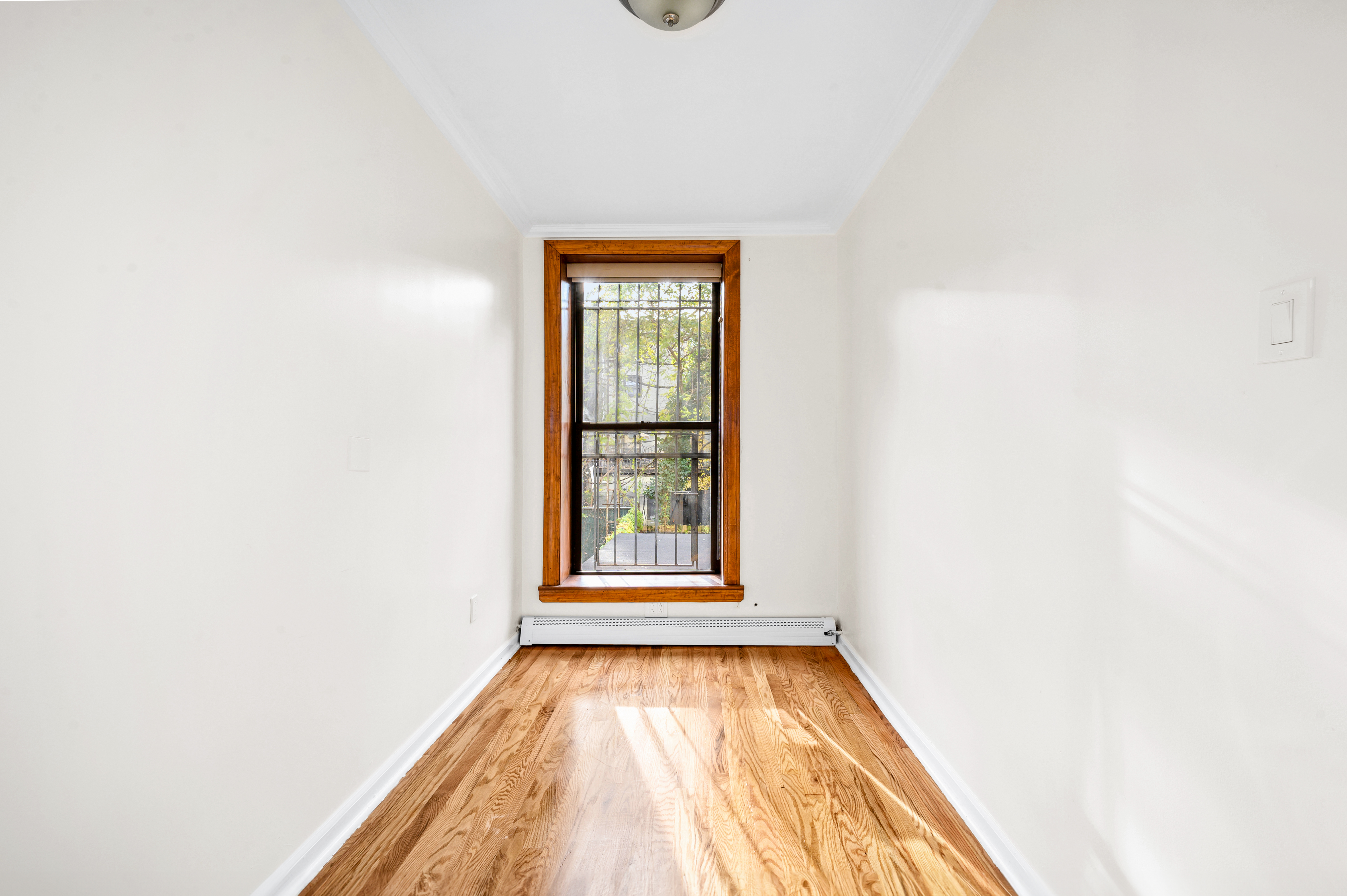 808 Lexington Avenue, Unit 1 Brooklyn, NY 11221 - Photo 5 of 8 a view of empty room with window