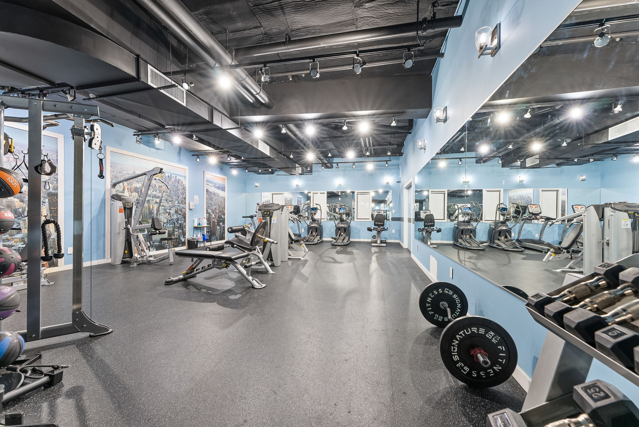 1919 Madison Avenue, Unit 214 Manhattan, NY 10035 - Photo 16 of 19 a view of a room with gym equipment