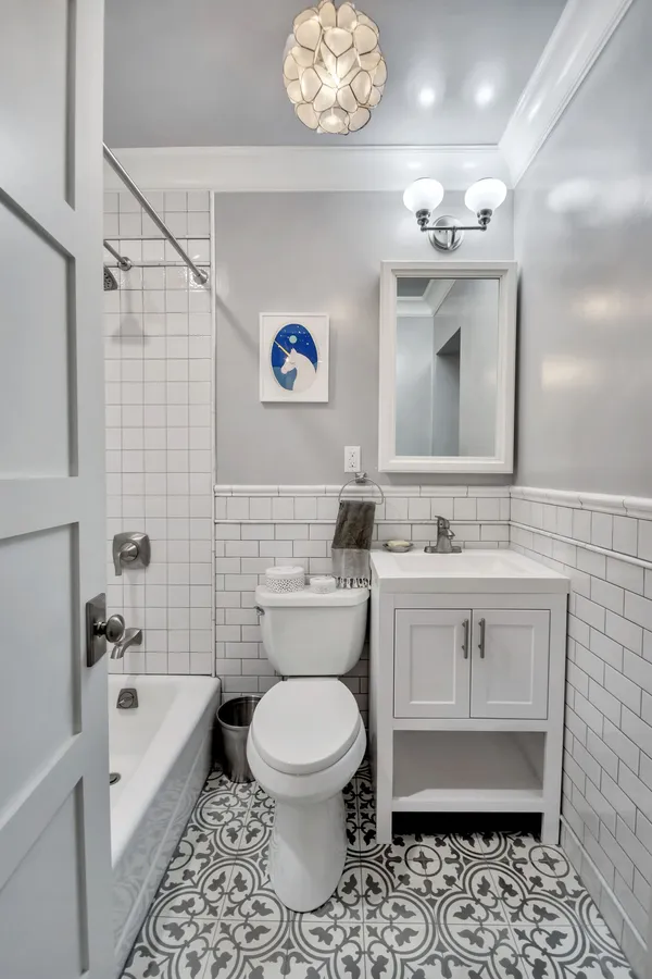 a bathroom with a sink a toilet and bathtub