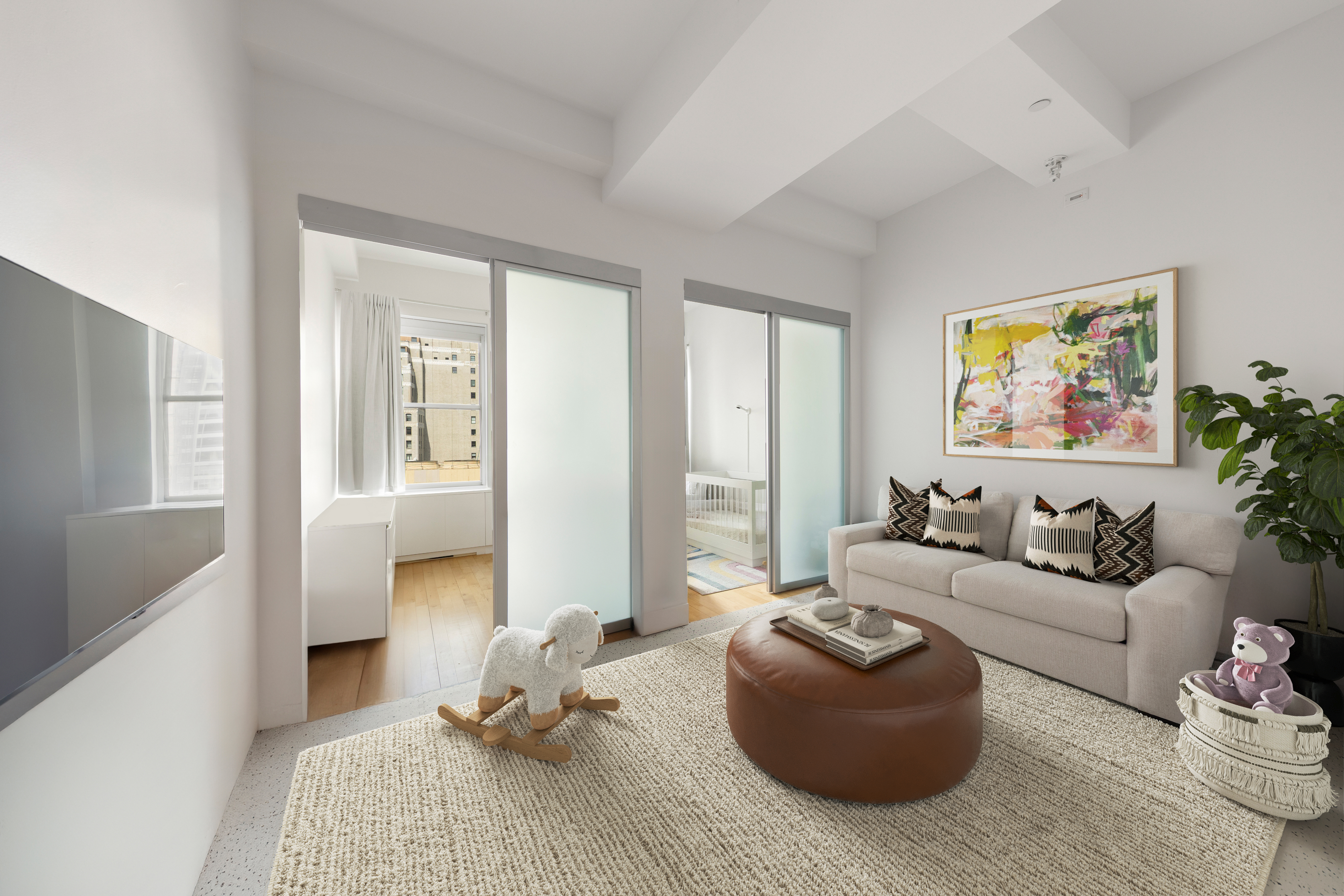 15 Broad Street, Unit 3100 Manhattan, NY 10005 - Photo 9 of 27 a living room with furniture and a couch