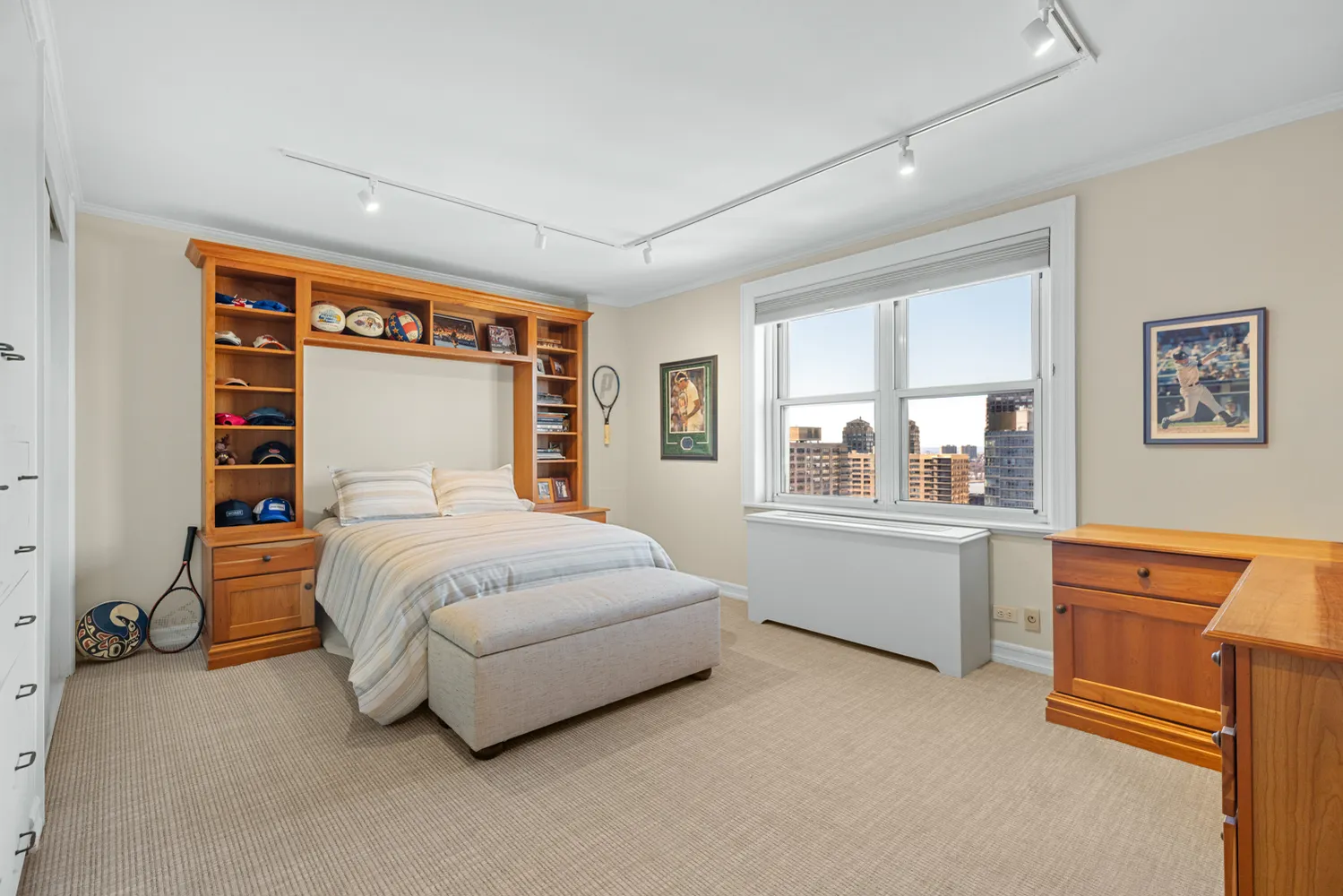 a bedroom with a large bed and a large window