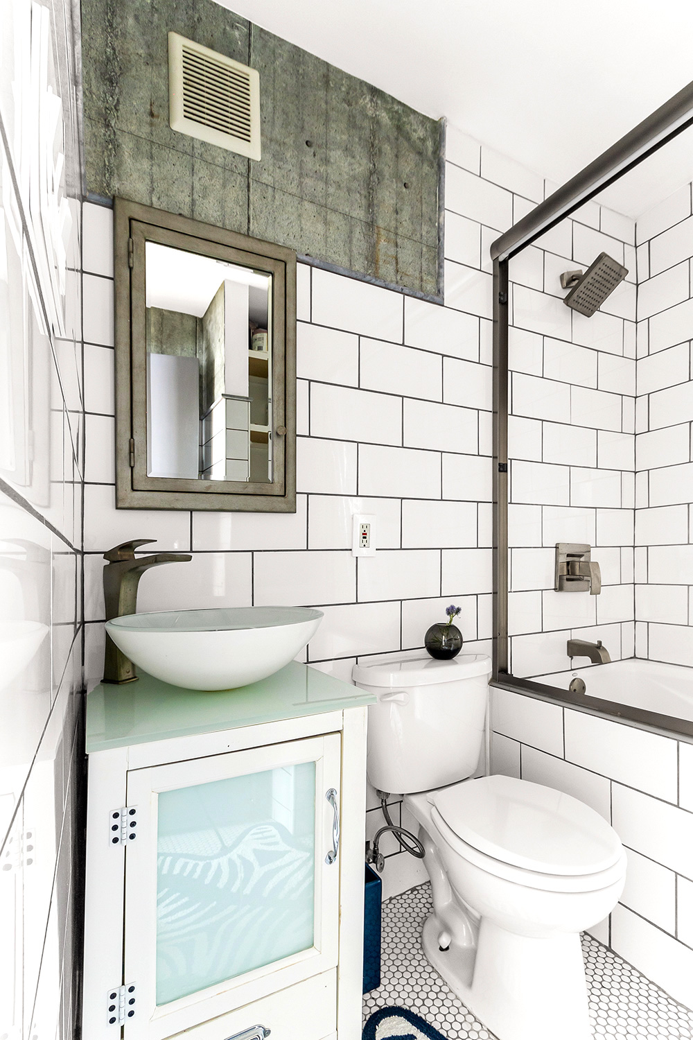 57 Thompson Street, Unit 2B Manhattan, NY 10012 - Photo 7 of 9 a bathroom with a sink a toilet and shower