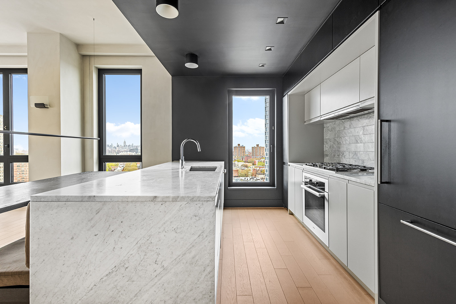 550 Vanderbilt Avenue, Unit 1508 Brooklyn, NY 11238 - Photo 4 of 17 a kitchen with granite countertop a sink a counter top space and stainless steel appliances