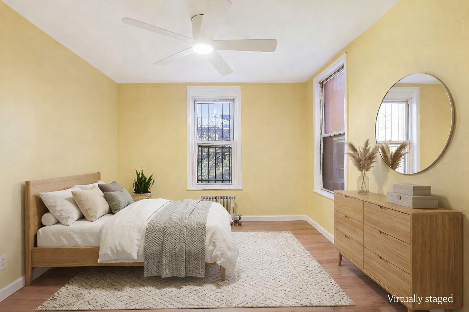 35-47 30th Street, Unit 1 Queens, NY 11106 - Photo 10 of 15 a bedroom with a bed and a mirror on the dresser