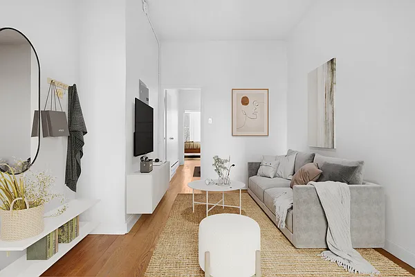 241 Himrod Street, Unit 3L Brooklyn, NY 11237 - Photo 1 of 5 a living room with furniture a flat screen tv and a wooden floor