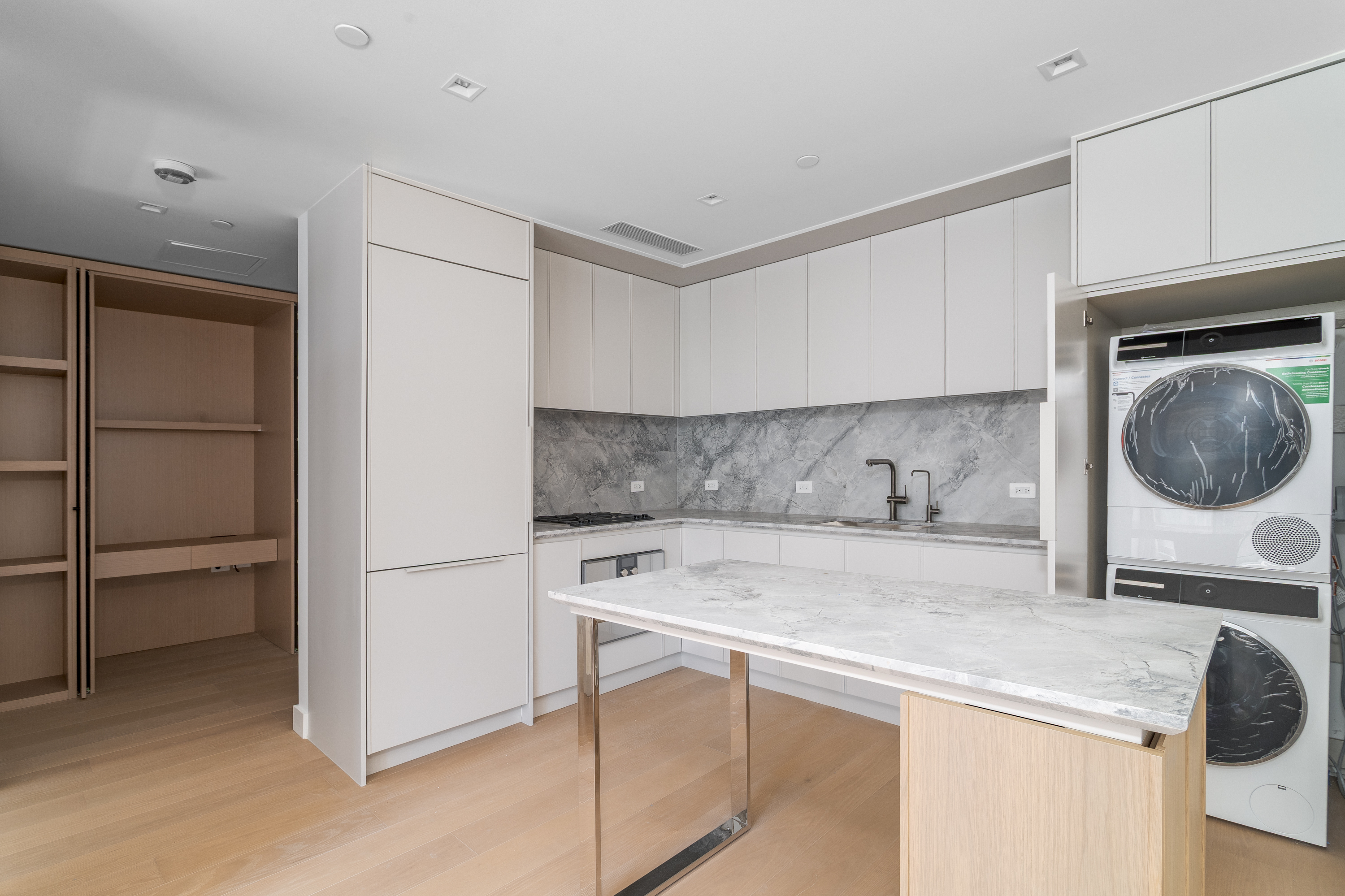 250 East 25th Street, Unit 4C Manhattan, NY 10010 - Photo 4 of 16 a kitchen with a sink a stove and a refrigerator