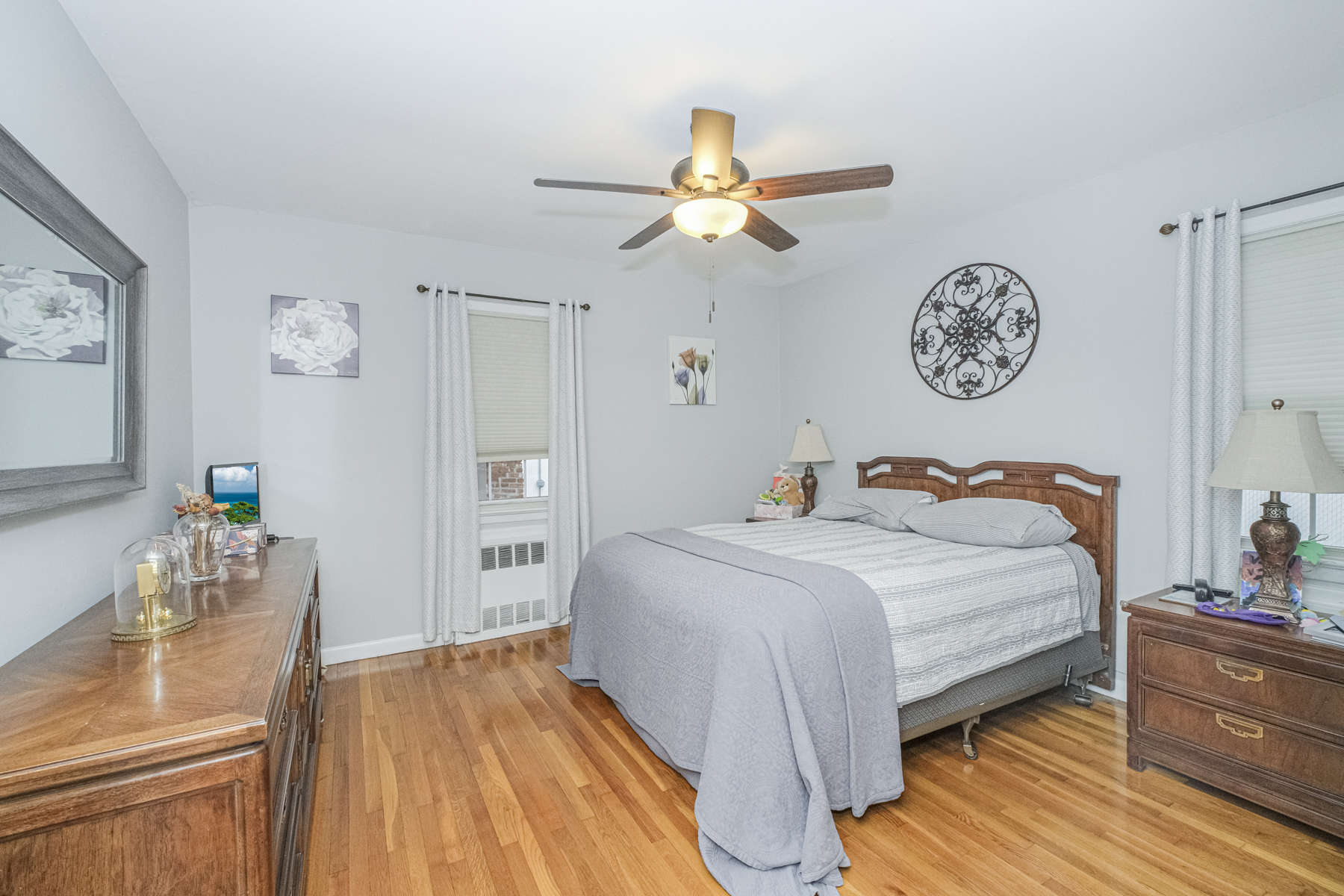 503 Falcon Avenue Staten Island, NY 10306 - Photo 11 of 30 a bedroom with a bed and a chandelier