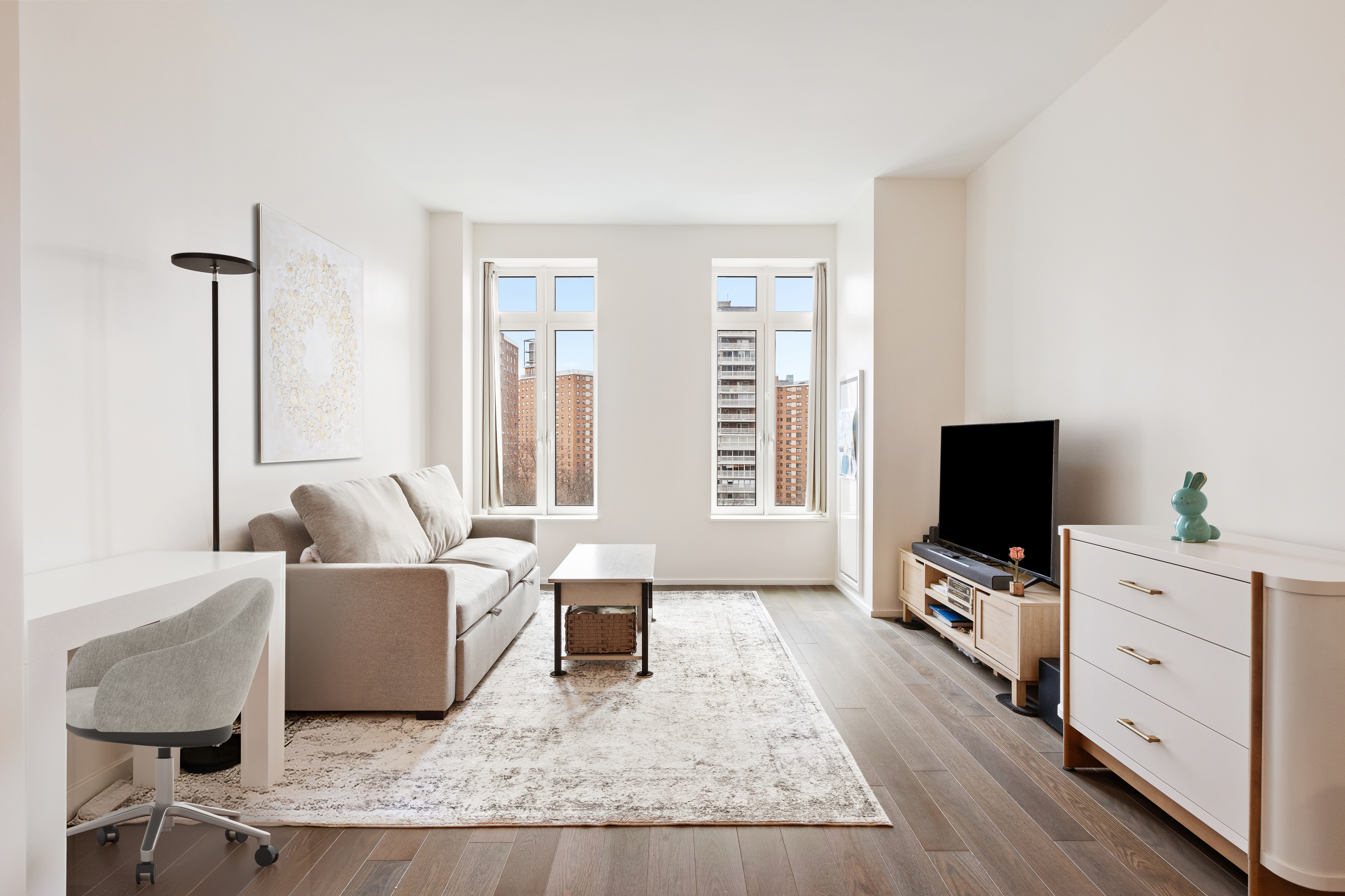 543 West 122nd Street, Unit 6B Manhattan, NY 10027 - Photo 1 of 17 a living room with furniture and a flat screen tv