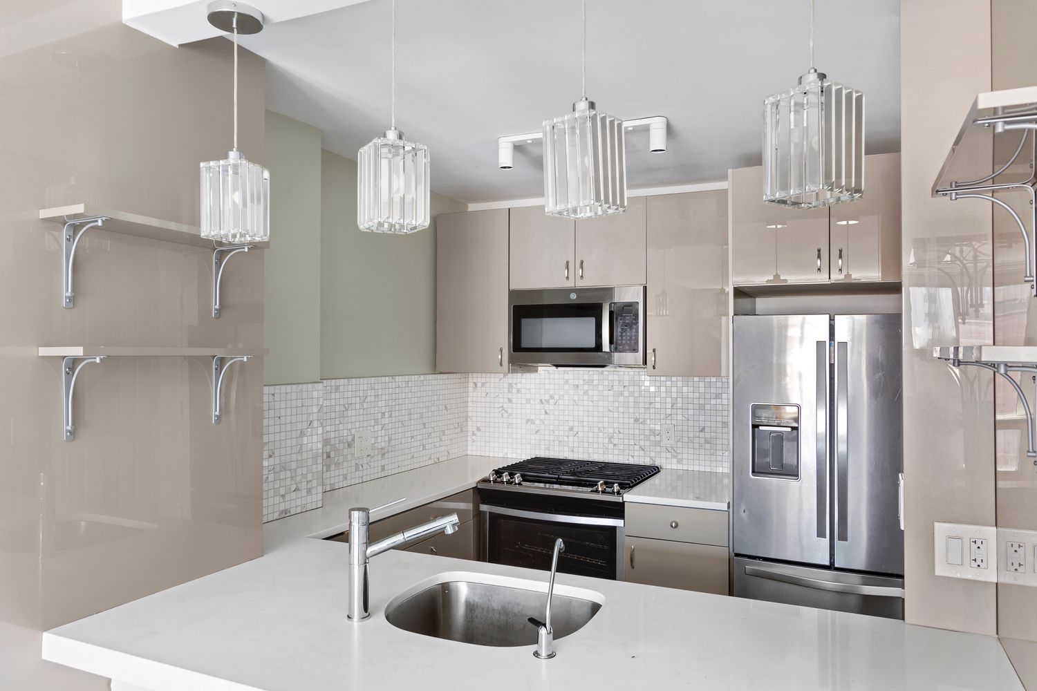 1 Irving Place, Unit U7BC Manhattan, NY 10003 - Photo 3 of 20 a kitchen with stainless steel appliances granite countertop a sink and a refrigerator