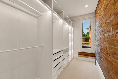a view of an empty walk in closet