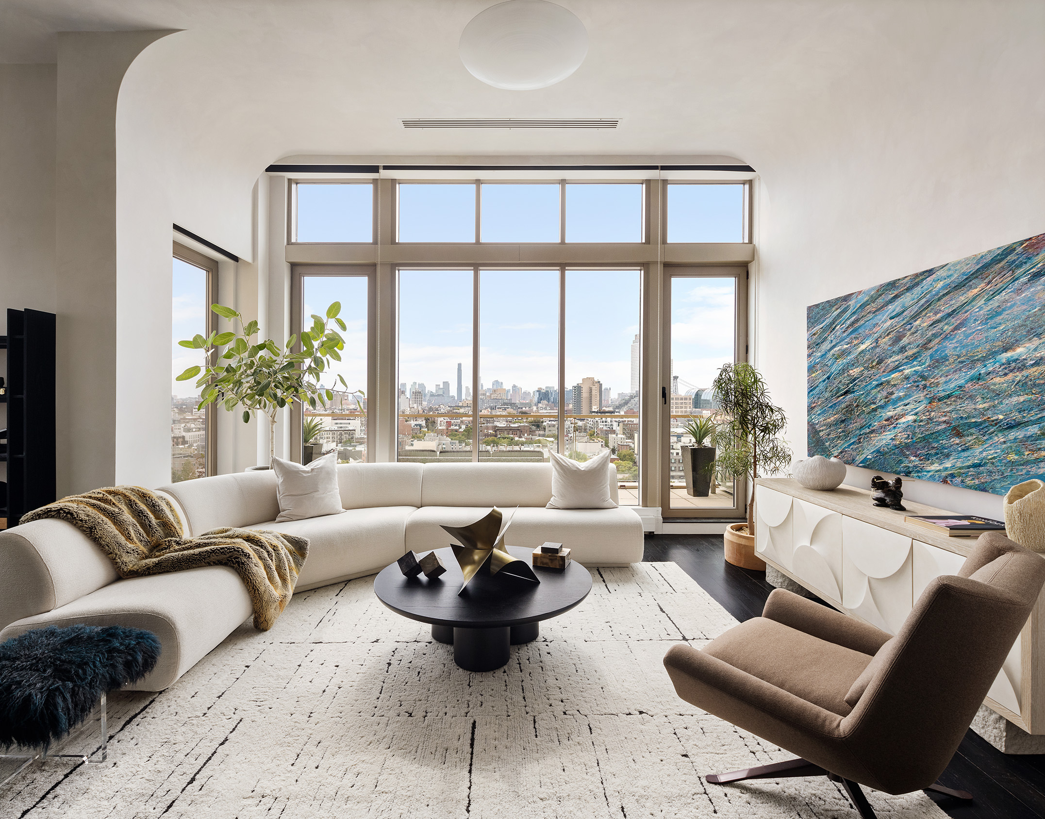 144 North 8th Street, Unit 12B Brooklyn, NY 11249 - Photo 1 of 15 a living room with furniture and a large window