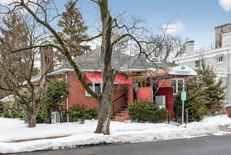 a view of a house with a street