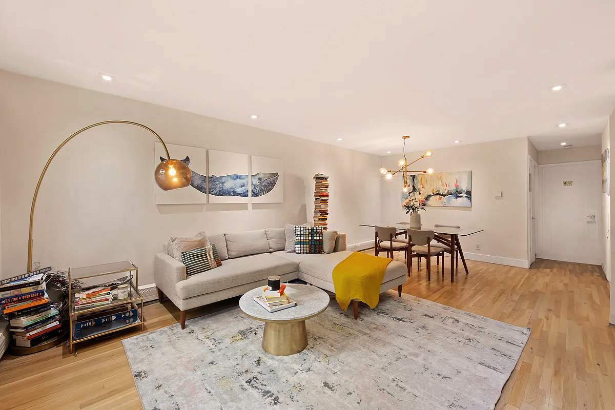 138 North 3rd Street, Unit 1 Brooklyn, NY 11249 - Photo 2 of 9 a living room with furniture and wooden floor