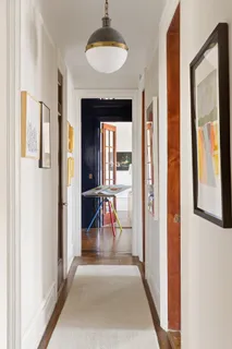 a view of a livingroom with furniture and a chandelier