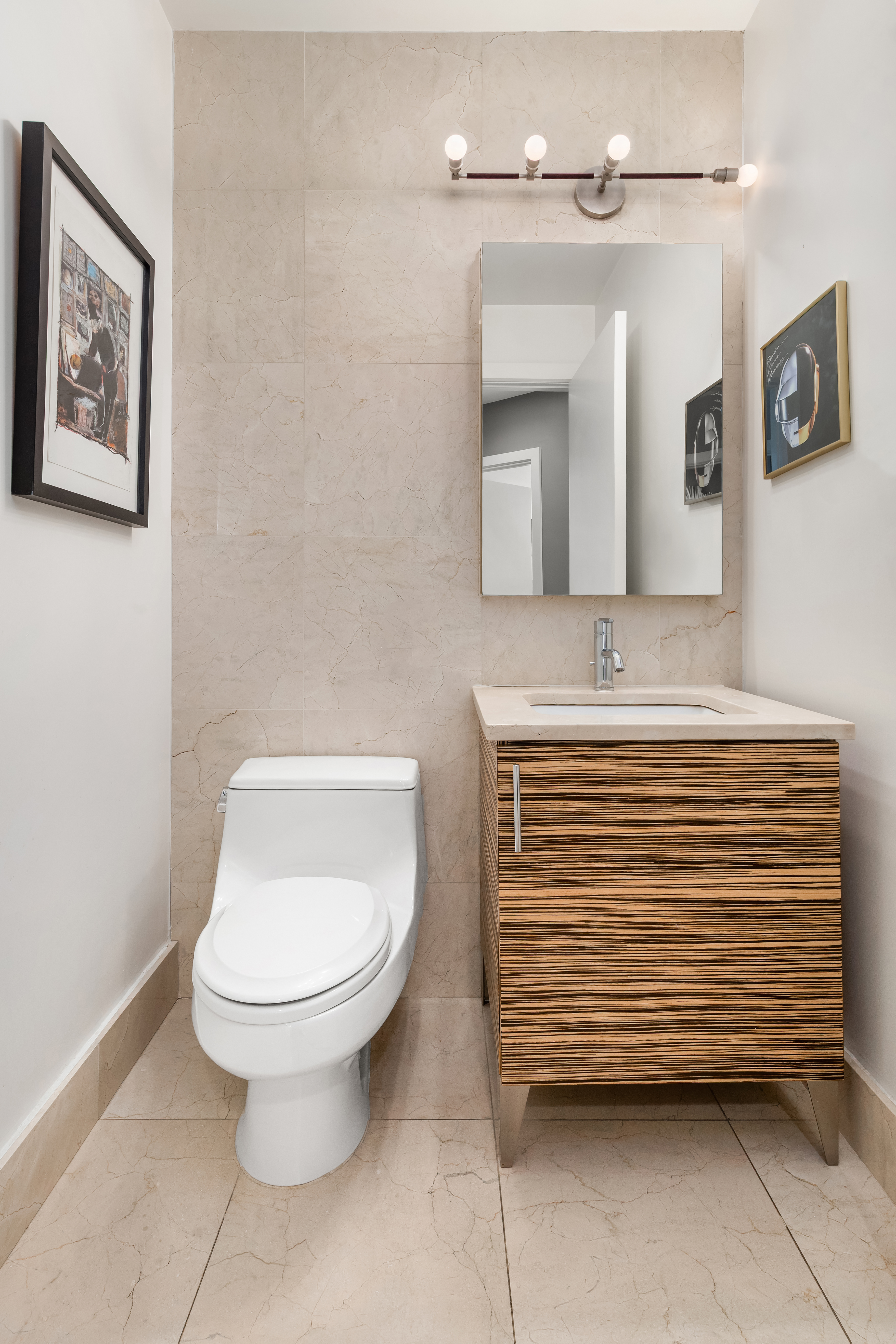 11-24 31st Avenue, Unit 5A Queens, NY 11106 - Photo 10 of 11 a bathroom with a toilet and a sink