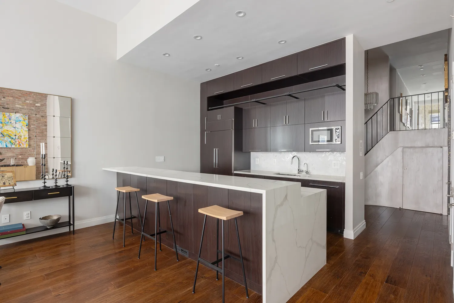a kitchen with sink and refrigerator
