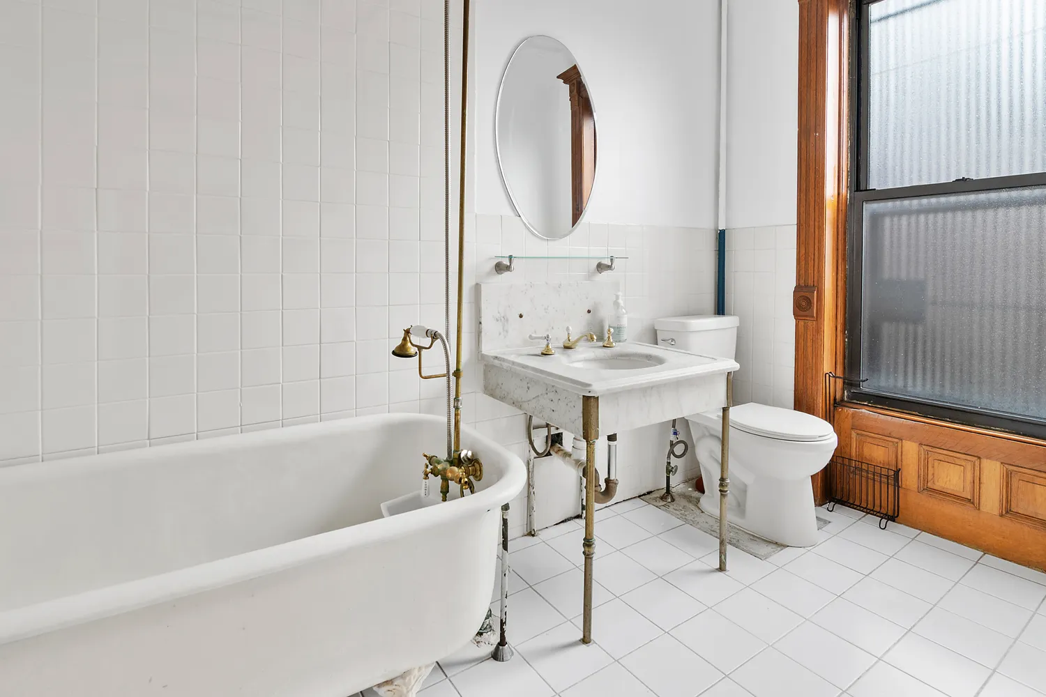 a bathroom with a sink mirror toilet and bathtub