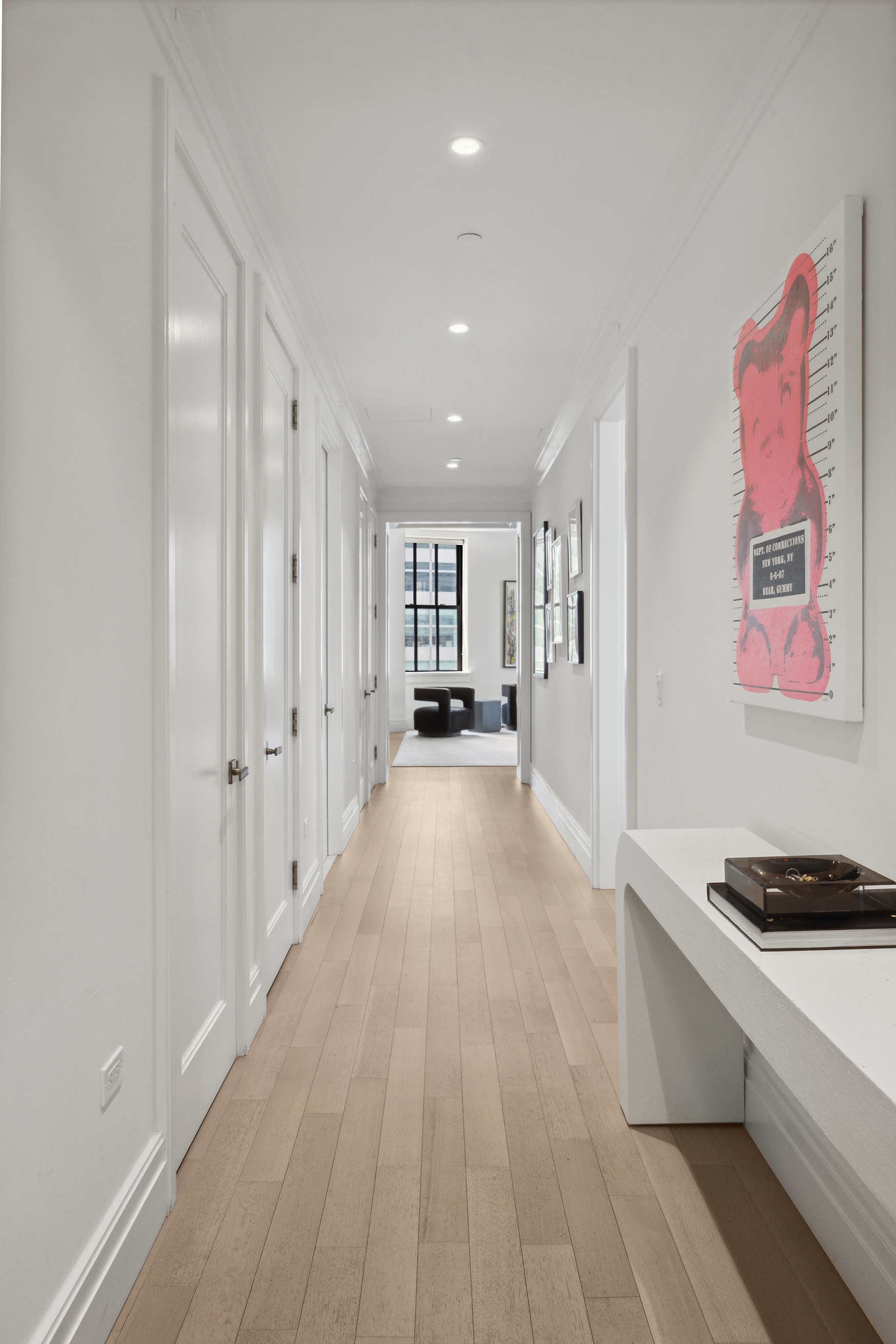 100 Barclay Street, Unit 15B Manhattan, NY 10007 - Photo 8 of 16 a view of a hallway with wooden floor and furniture