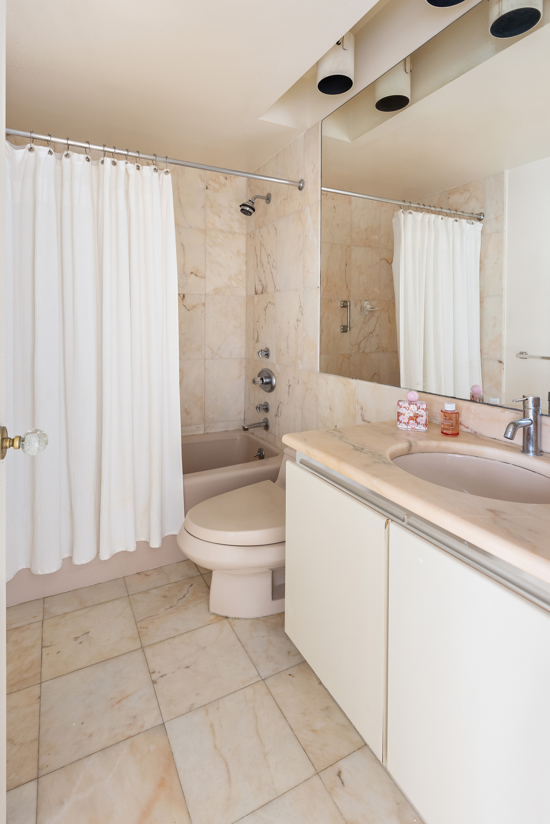 7 Gramercy Park West, Unit 6AB Manhattan, NY 10003 - Photo 6 of 12 a bathroom with a sink a toilet and shower